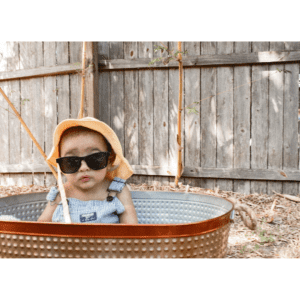 6 month baby in a basket outside